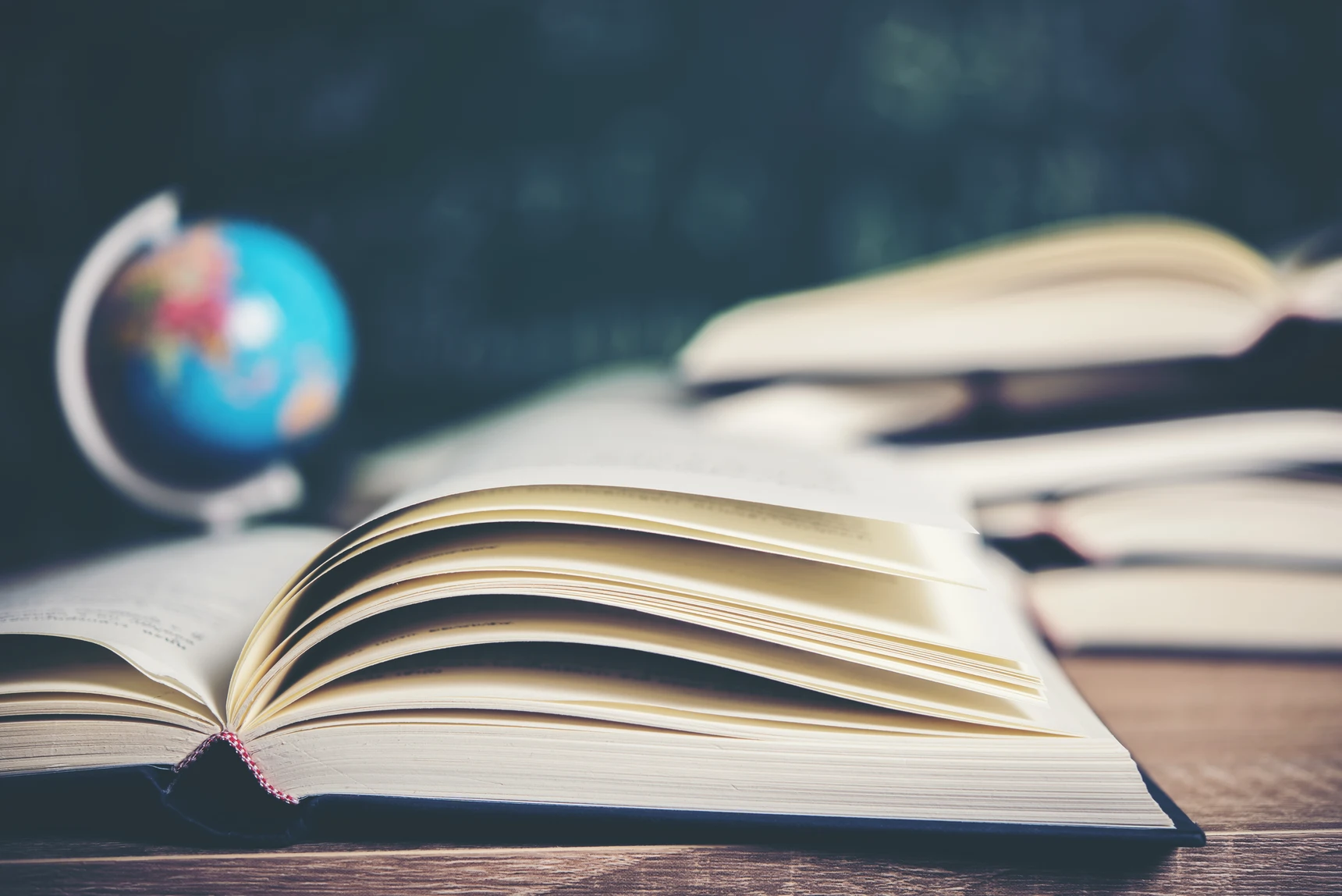 open-book-with-green-board-background-2026-01-07-00-57-06-utc